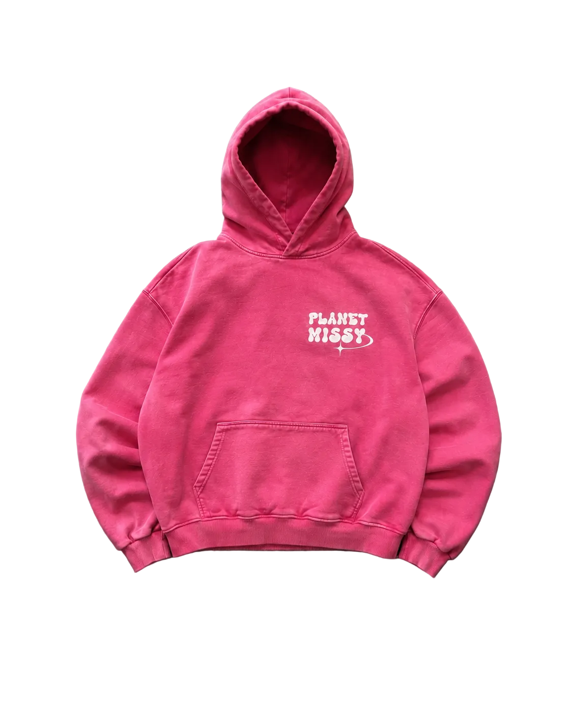 A bright pink washed cotton hoodie with a white 'PLANET KISS' graphic on the chest, laid flat on a textured gray concrete surface.