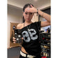 Off shoulder black number tee