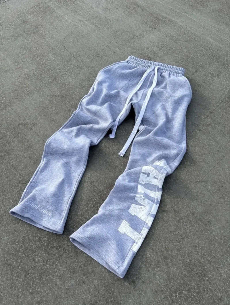 Nuevo traje de streetwear hip-hop para hombres, chándal casual retro con estampado de letras, sudadera con cremallera gris Harajuku para mujeres